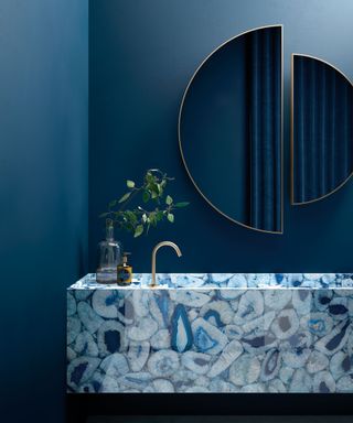 Blue bathroom with stone basin