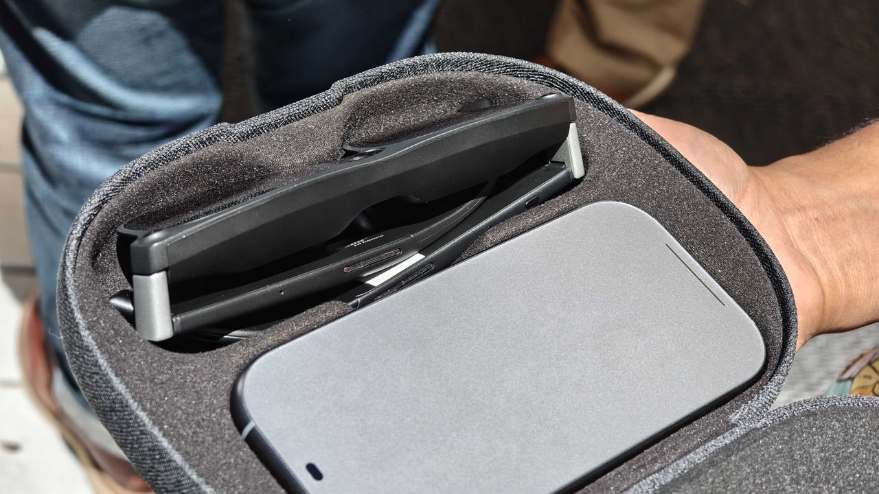 Xreal Project Aura glasses and puck in the case