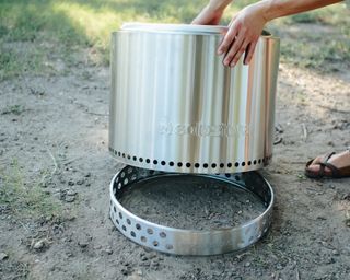A Solo Stove stainless steel smokeless fire pit