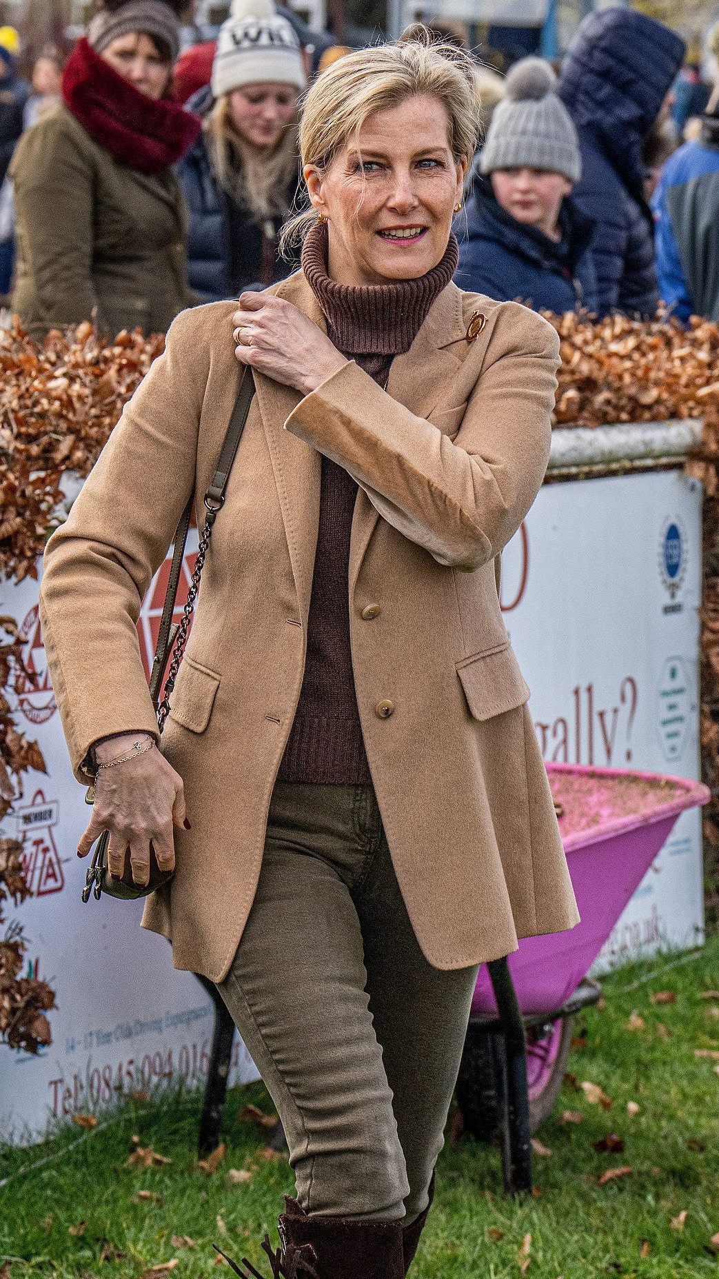 Sophie, Duchess of Edinburgh holds her bag strap as she visits the National Shire Horse Show, Newark Showground 2022