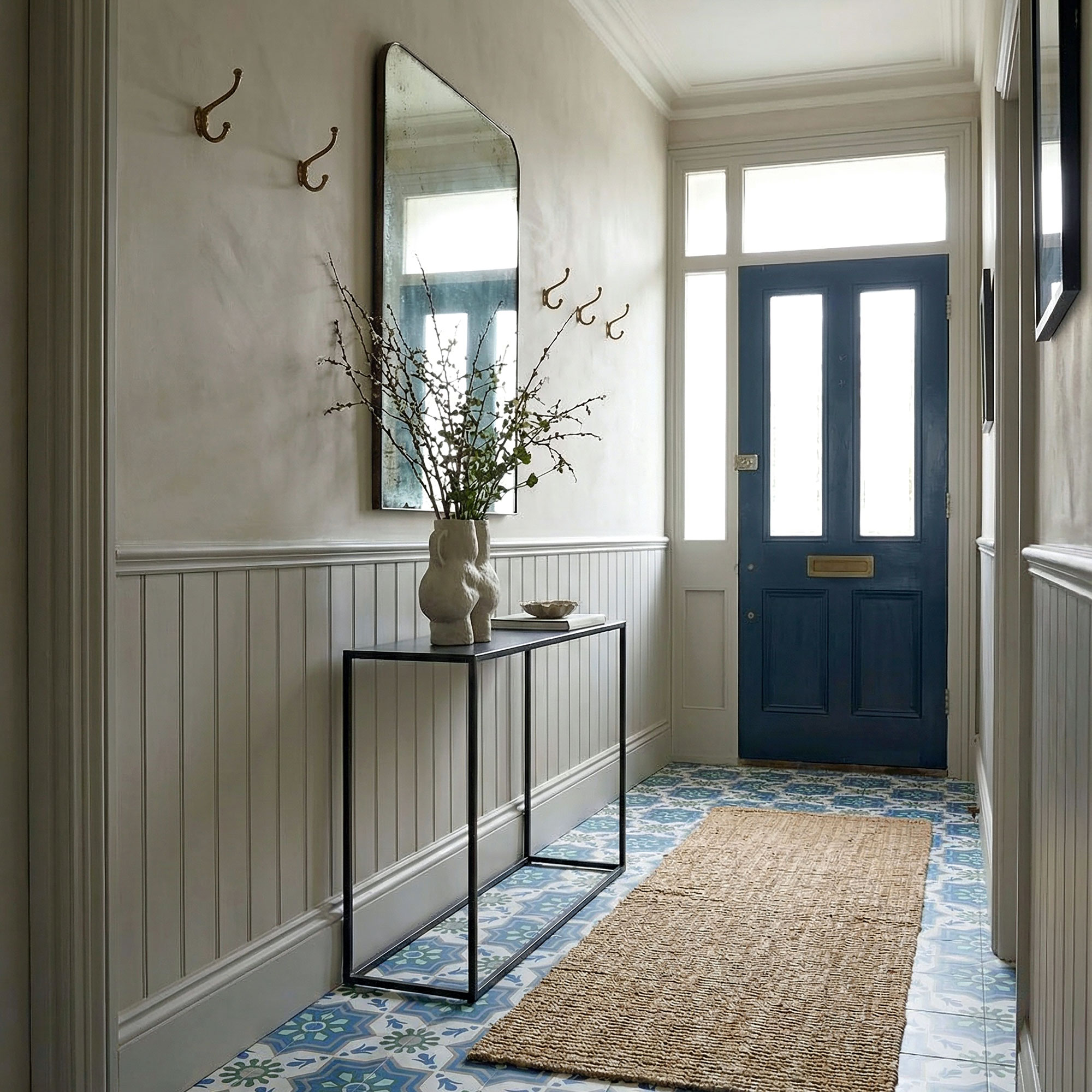 Plaster pink walls and console table and sisal rug