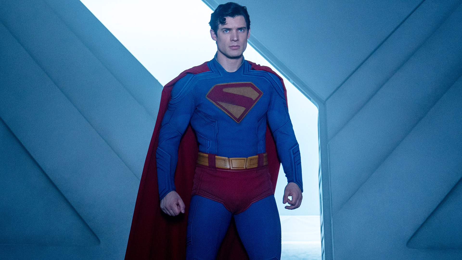 A stern-looking Clark Kent standing in the Fortress of Solitude in James Gunn&#039;s Superman movie
