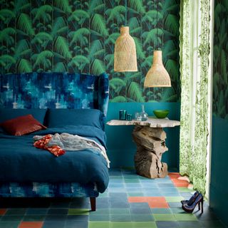 jungle themed bedroom with blue patterned headboard