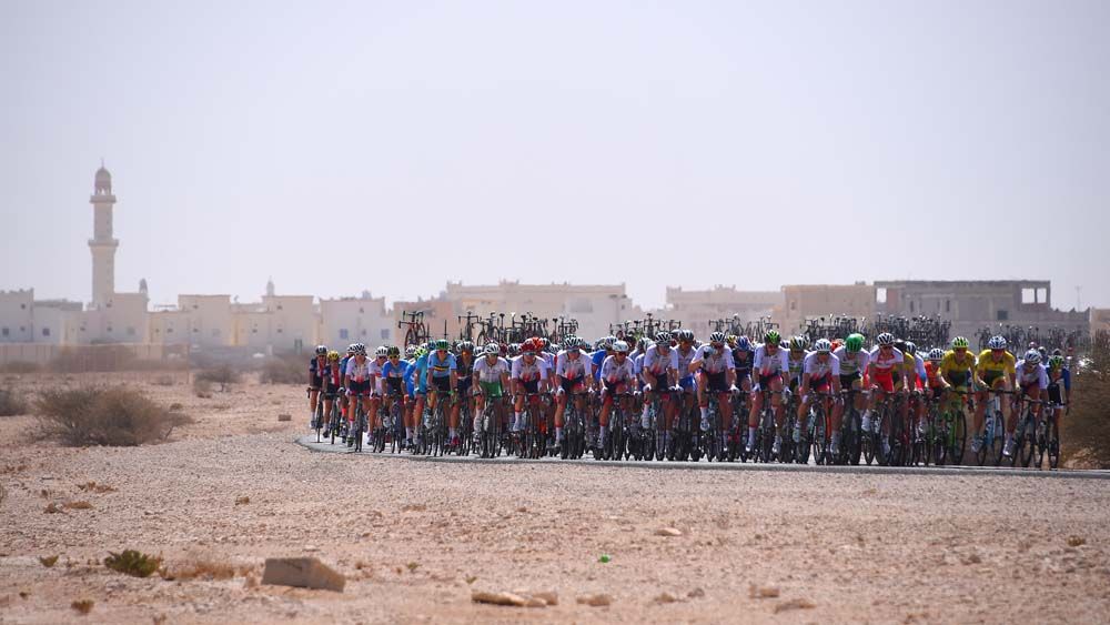 The men's peloton in the desert of Qatar at the 2016 Road World Championships