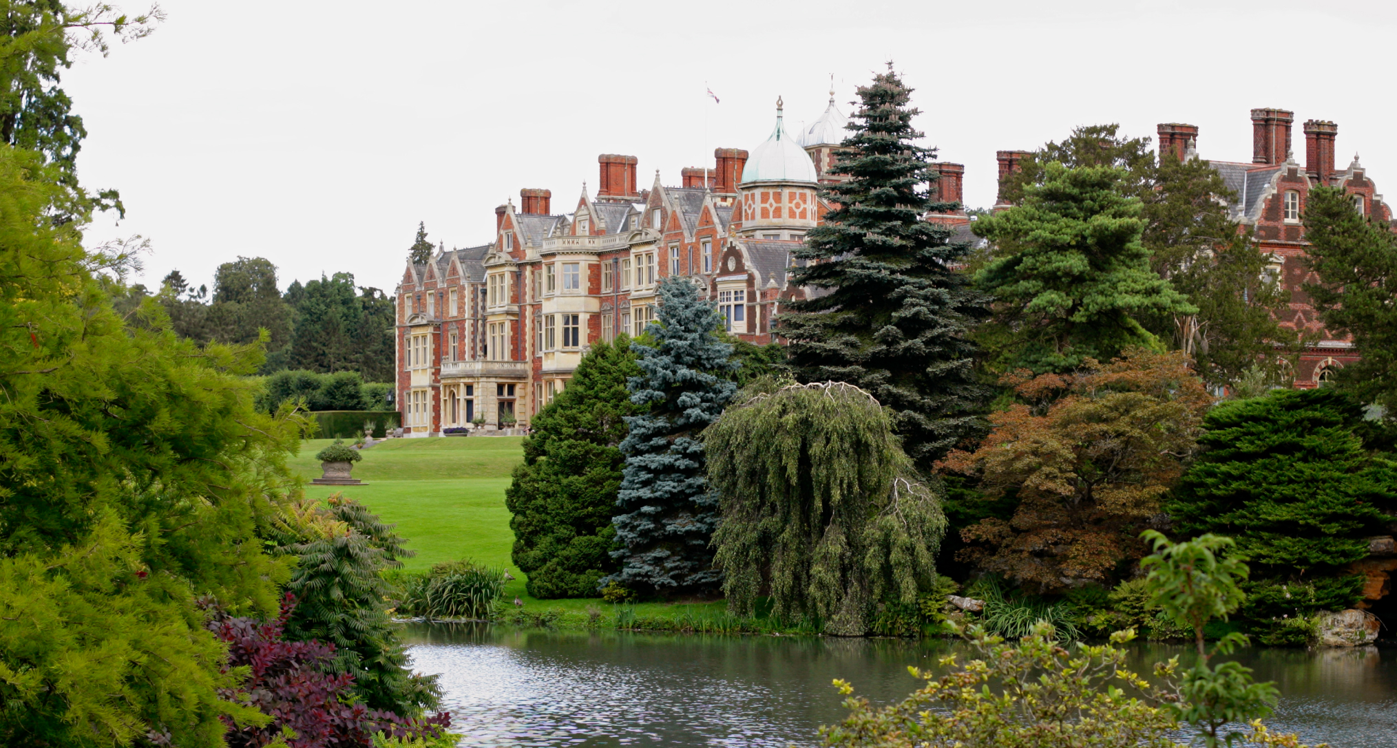 Exterior of Sandringham House with a pond in front