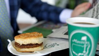 a sausage biscuit, hot coffee and some light ready during Practice Round 1 for the Masters at Augusta National Golf Club, Monday, April 2, 2018