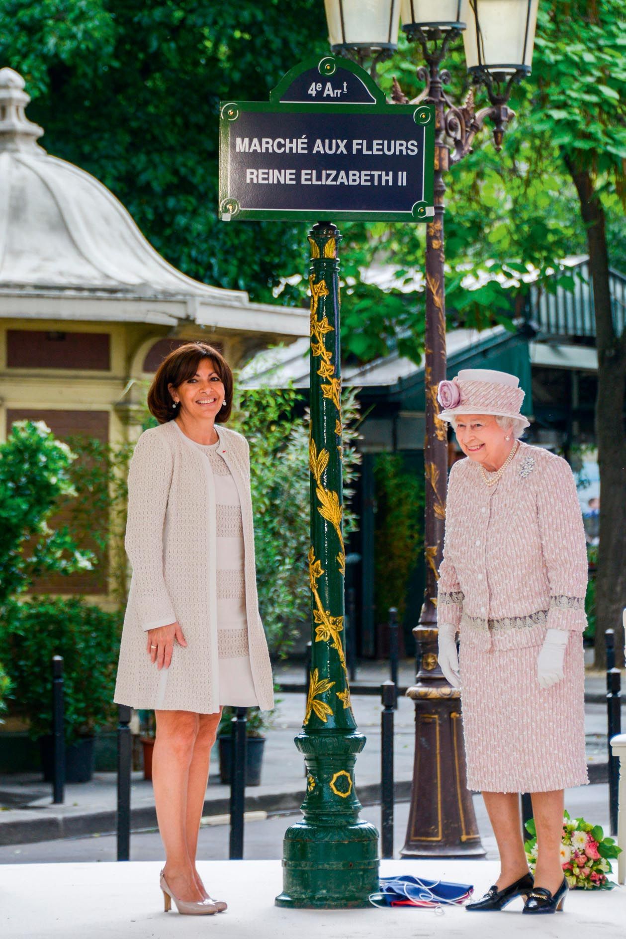 Anne Hidalgo, Mayor of Paris, looks on as Queen Elizabeth II unveils a sign renaming Paris Flower Market on June 7, 2014. Photo by Ammar Abd Rabbo/ABACAPRESS.COM.