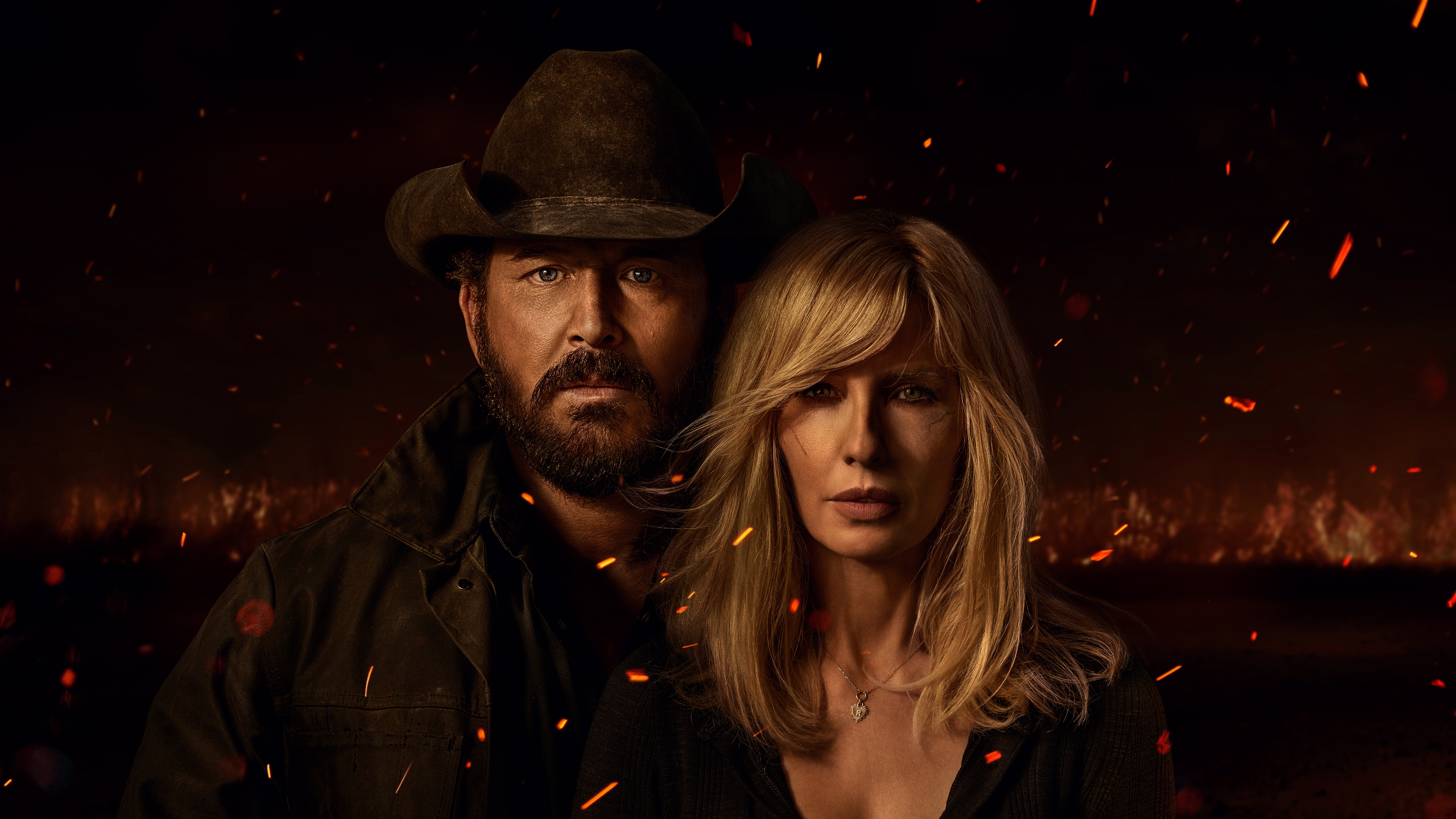 Rip Wheeler and Beth Dutton in the key art for Dutton Ranch.