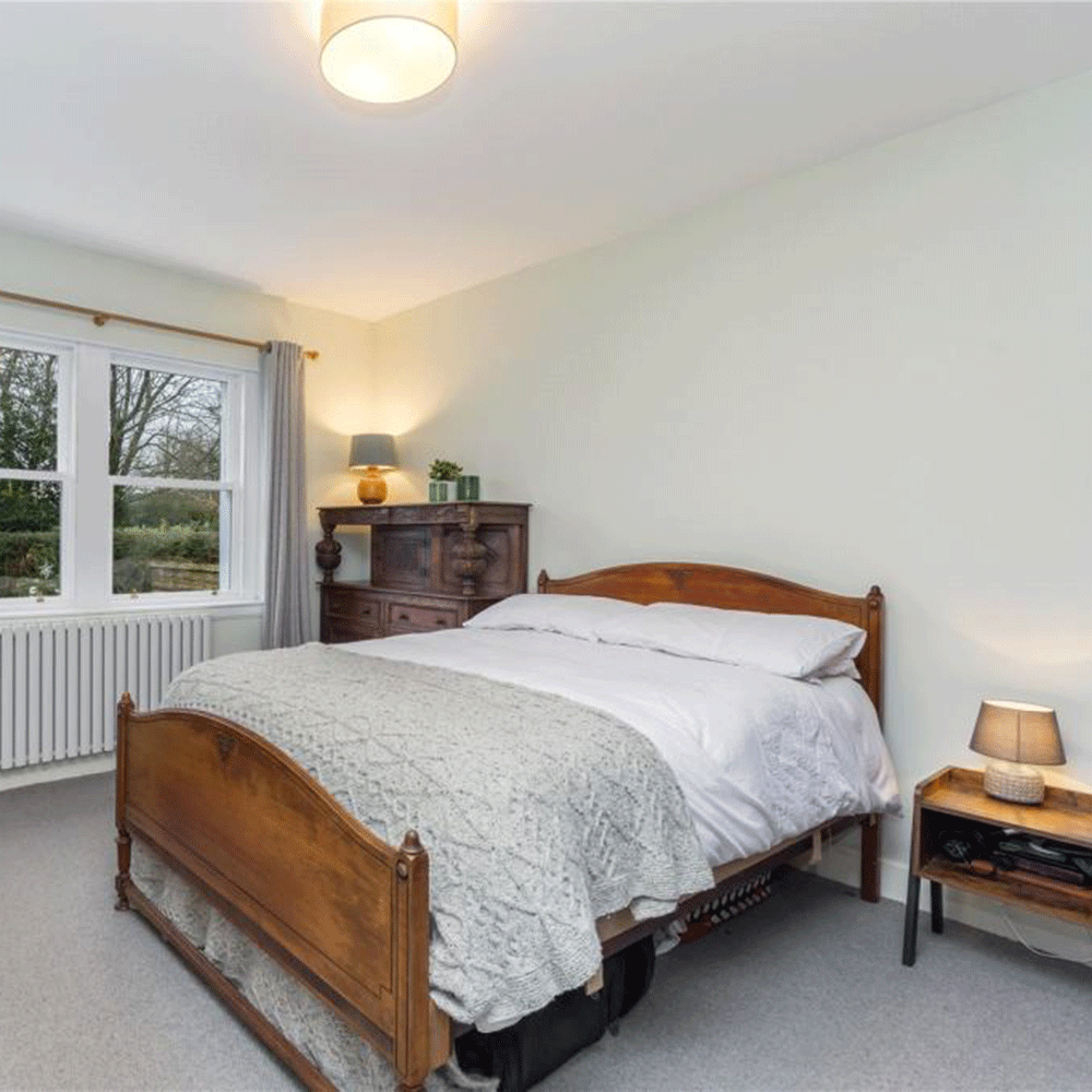 bedroom with wooden bed