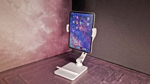 A shot of the HoverBar Duo iPad stand holding an iPad Pro on a dark background