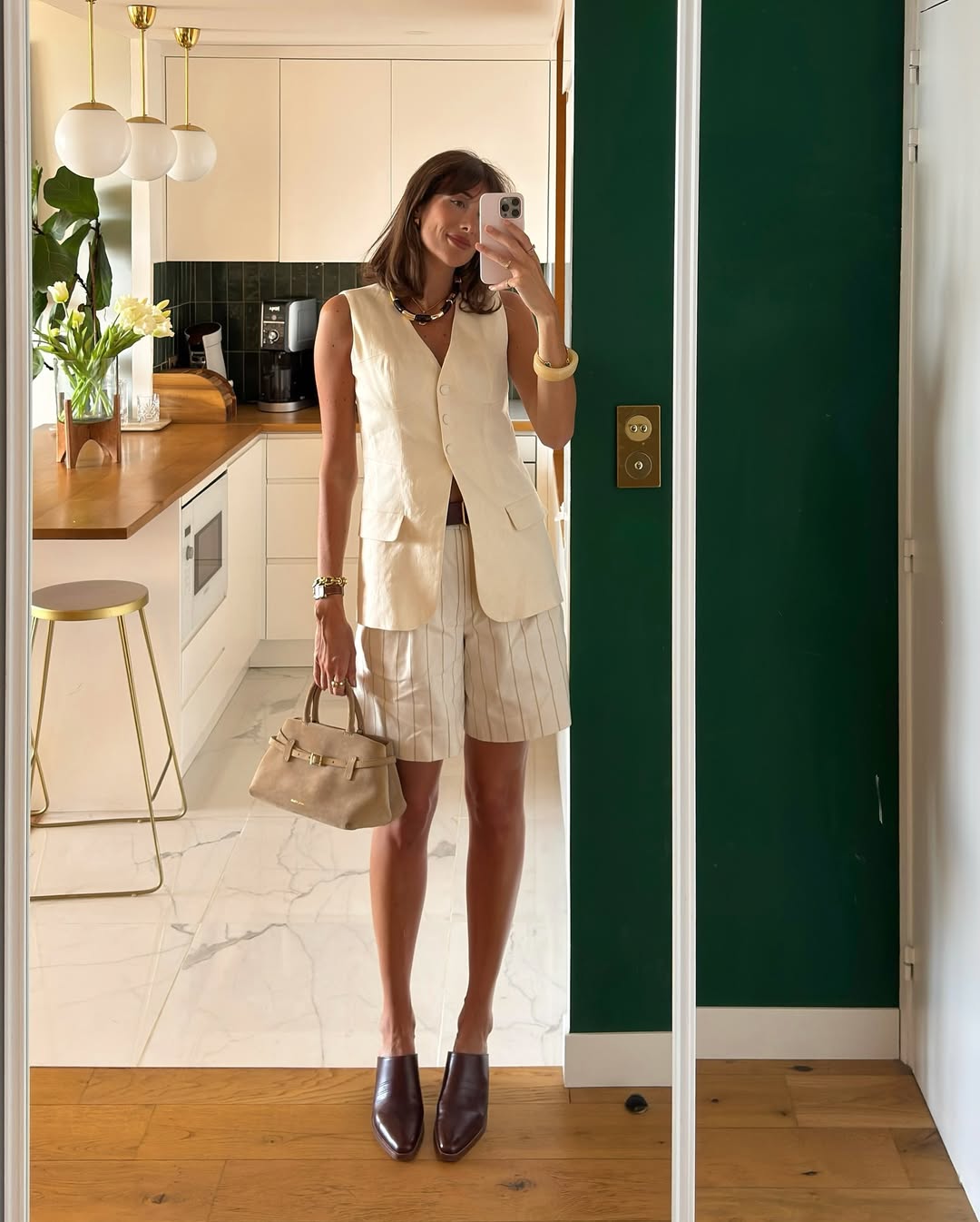 @juliesfi wearing linen waistcoat and shorts