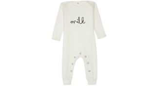 cream baby grow with the word Milk across the front as part of our best baby shower gifts round up