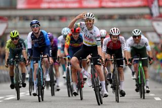 BARCELONA SPAIN MARCH 24 Tadej Pogacar of Slovenia and UAE Emirates Team Green Leader Jersey celebrates at finish line as stage winner ahead of LR Stephen Williams of Great Britain and Team IsraelPremier Tech Patrick Konrad of Austria and Team LidiTrek Guillaume Martin of France and Team Cofidis and David Gonzalez of Spain and Team Caja RuralRGA during the 103rd Volta Ciclista a Catalunya 2024 Stage 7 a 1453km stage from Barcelona to Barcelona UCIWT on March 24 2024 in Barcelona Spain Photo by David RamosGetty Images