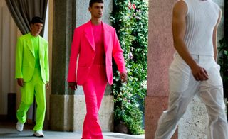Versace S/S 2019 - Model wears a neon pink suit