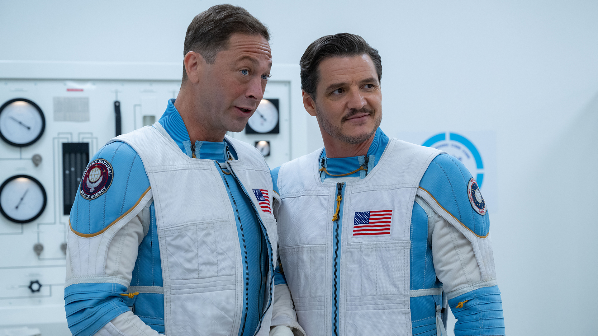 Ben Grimm talking to a smiling Reed Richards while wearing their spacesuits in The Fantastic Four: First Steps