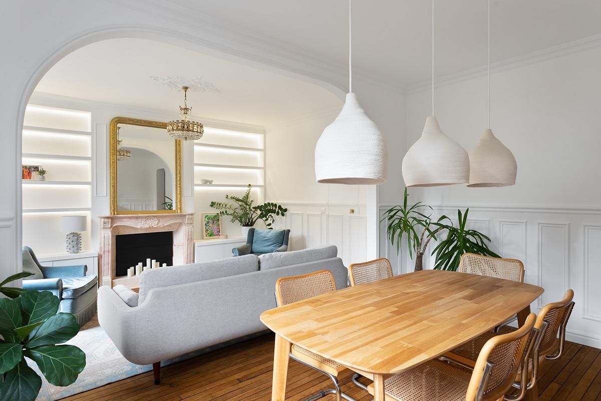 A living room and dining area separated by the clever use of furniture