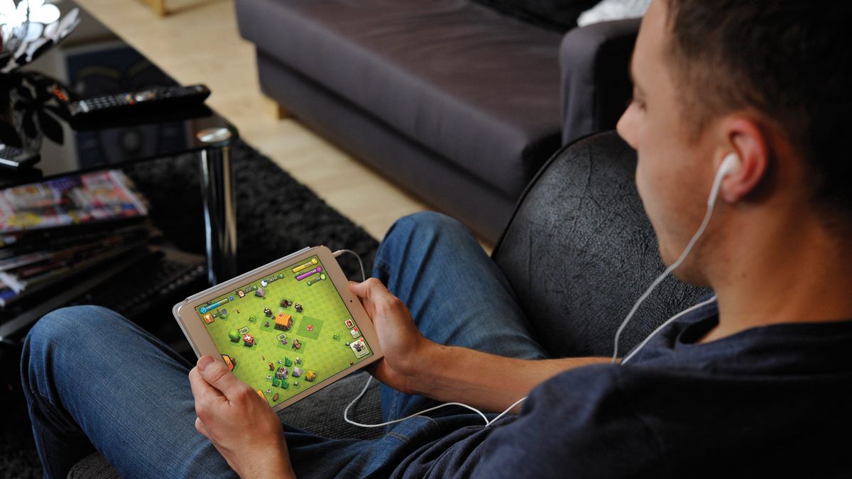 Person gaming on Apple iPad