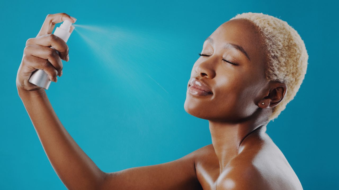 woman using face mist for an article on the Avon Adapt range