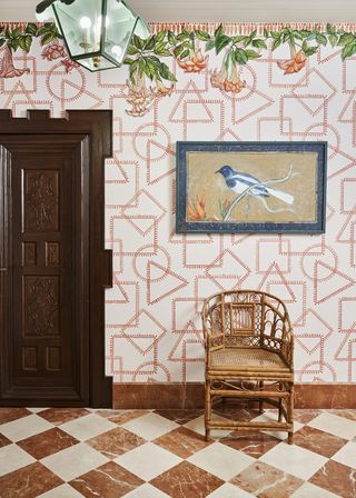 checkerboard floor and red patterned wallpaper in a hallway
