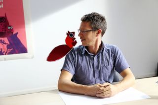 how to make a children's picture book Photo of Chris Haughton with illustrated animal on shoulder