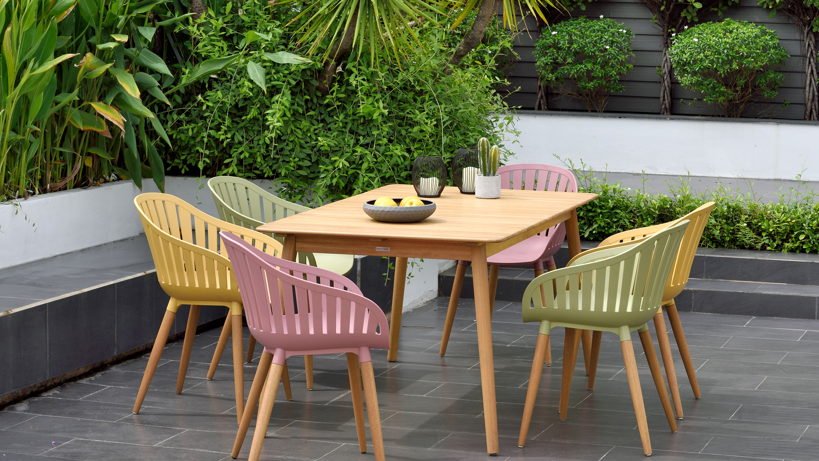 colourful garden furniture on paved patio