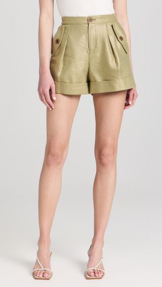 a model wears green shorts
