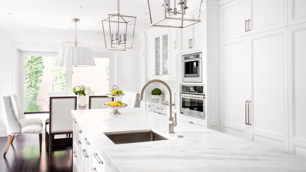 White kitchen with marble countertops