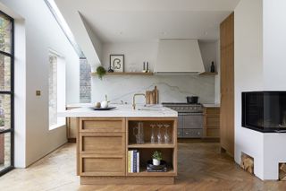 A bright kitchen with an island in the middle of the room
