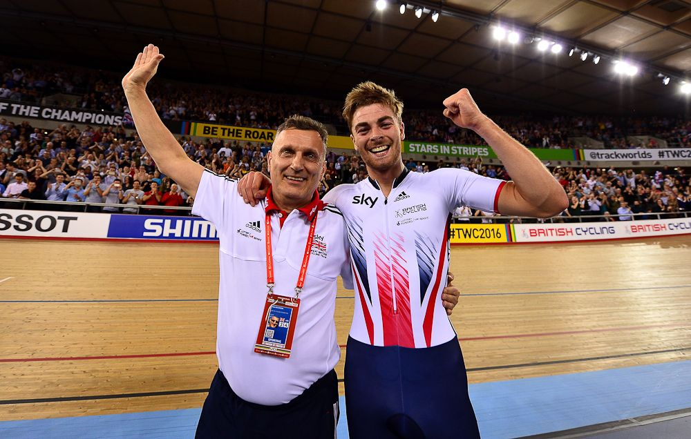 Jonathan Dibben of Great Britain celebrates with coach Heiko Salzwedel after winning the final of the Mens Points Race