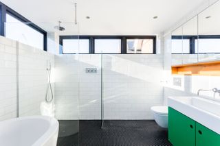 a bathroom with clerestory windows