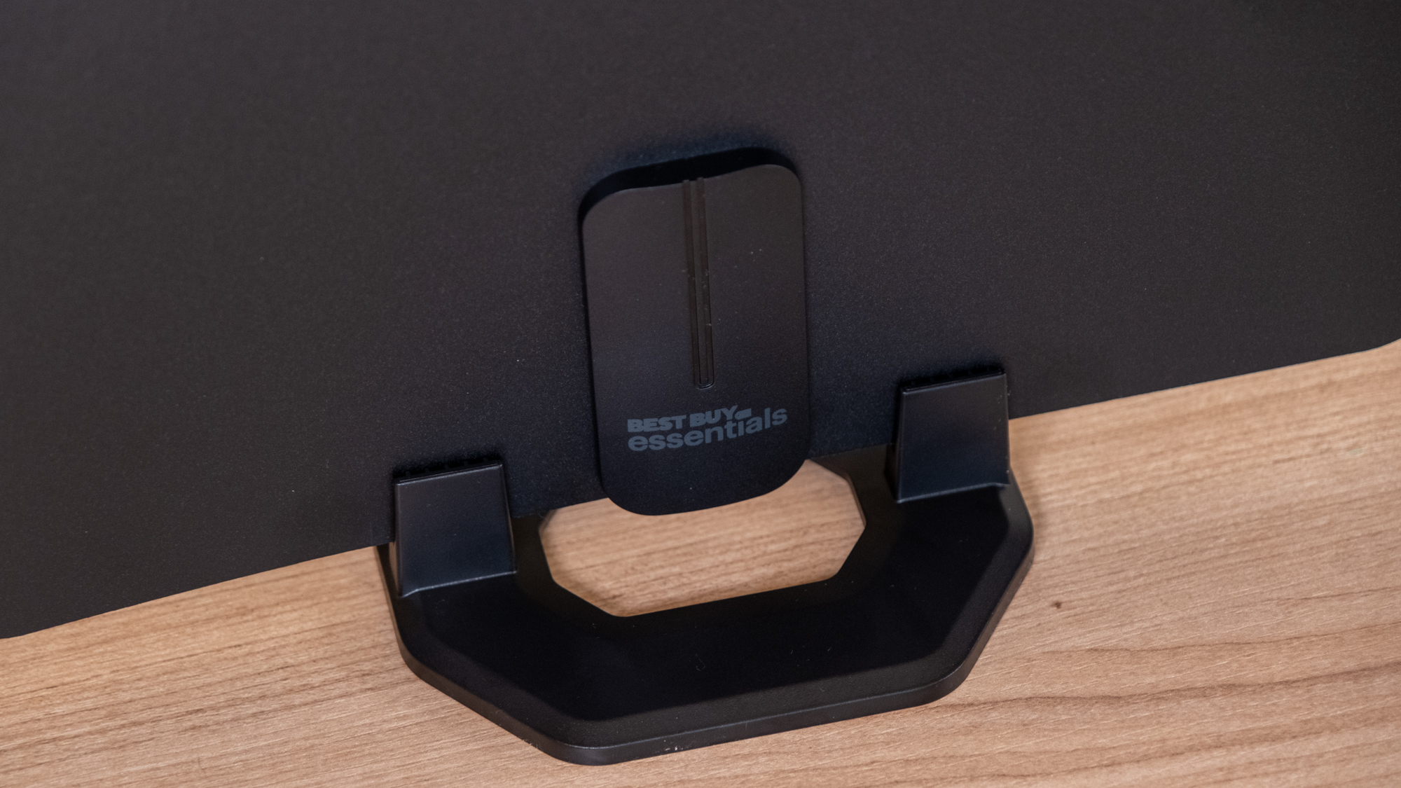 The Best Buy Essentials Ultra-Thin Amplified HDTV Antenna on a desk.