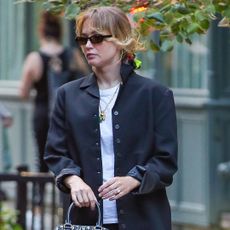 Jennifer Lawrence was spotted with a Dior bag in tow alongside flats and a satin skirt in New York City