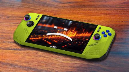 MSI Claw A8 in green with woodgrain surface in backdrop and sad text face on screen.