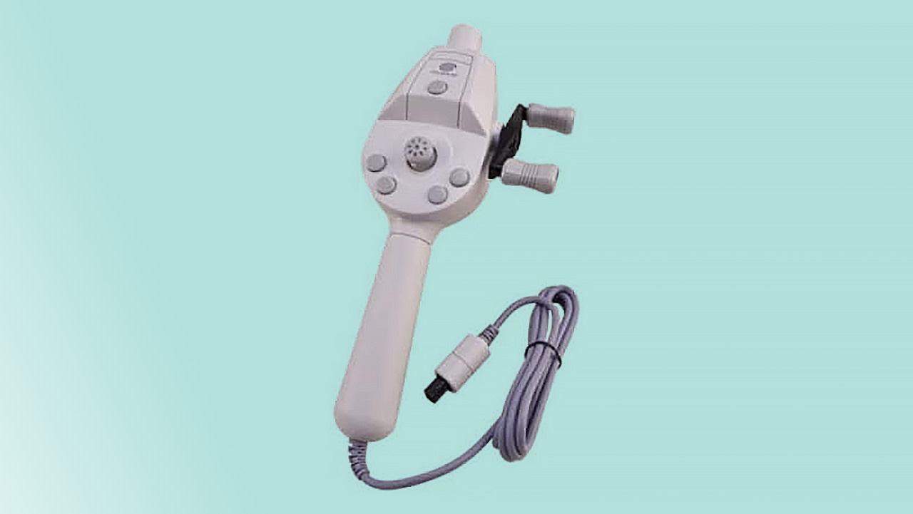 Sega Dreamcast Fishing Controller on green background