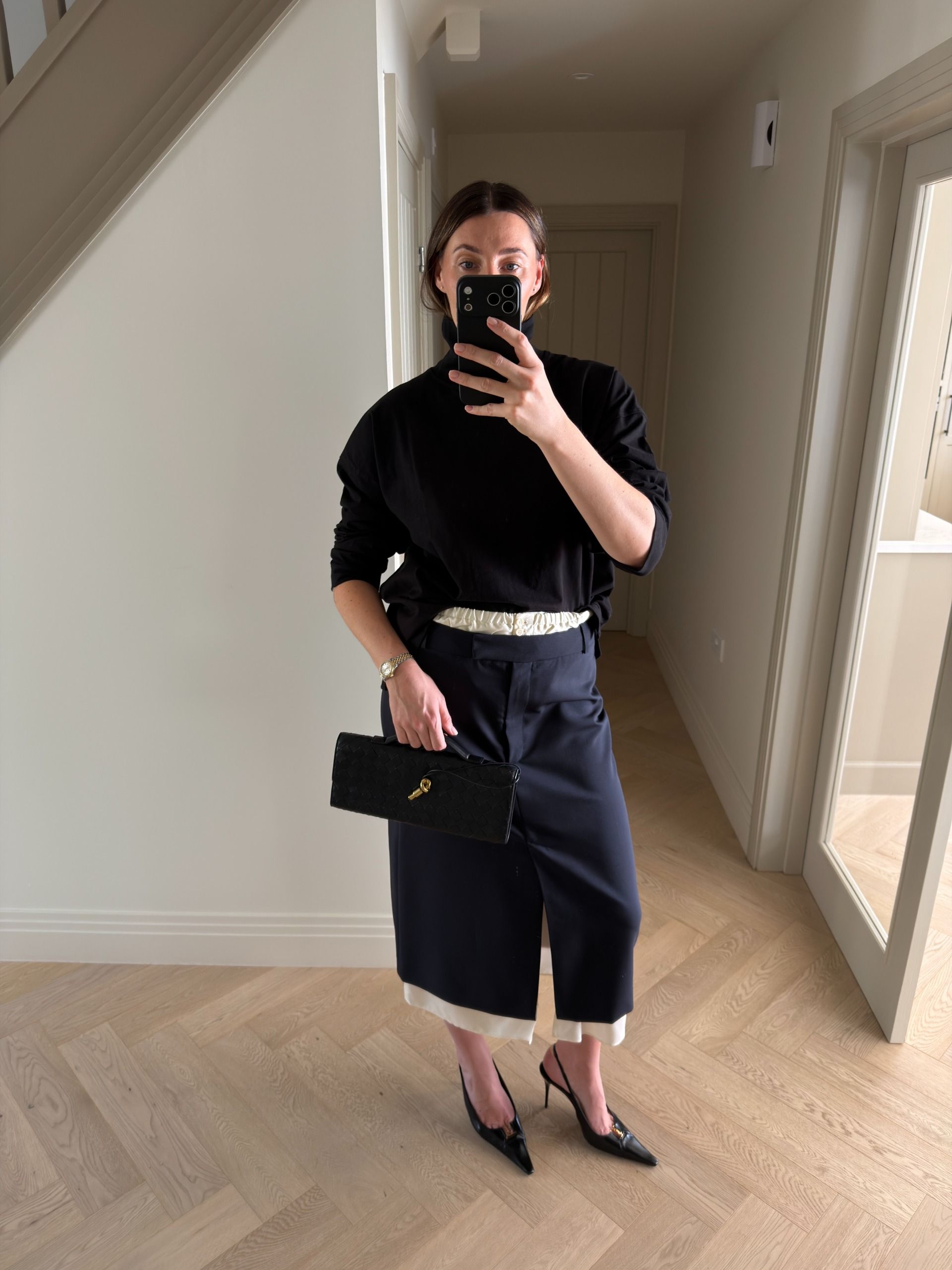 An image of a woman wearing skirt with slits outfit fall 2026