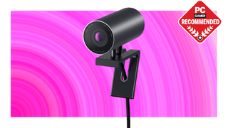 Dell UltraSharp WB7022 webcam on a pink background