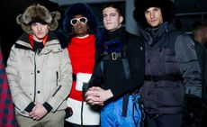 Models wearing Moncler winter ski clothing in beige, red, blue and grey, with fur hats