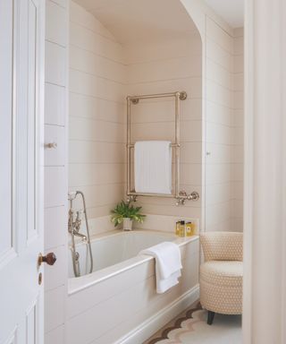 wooden panelled bath nook painted white