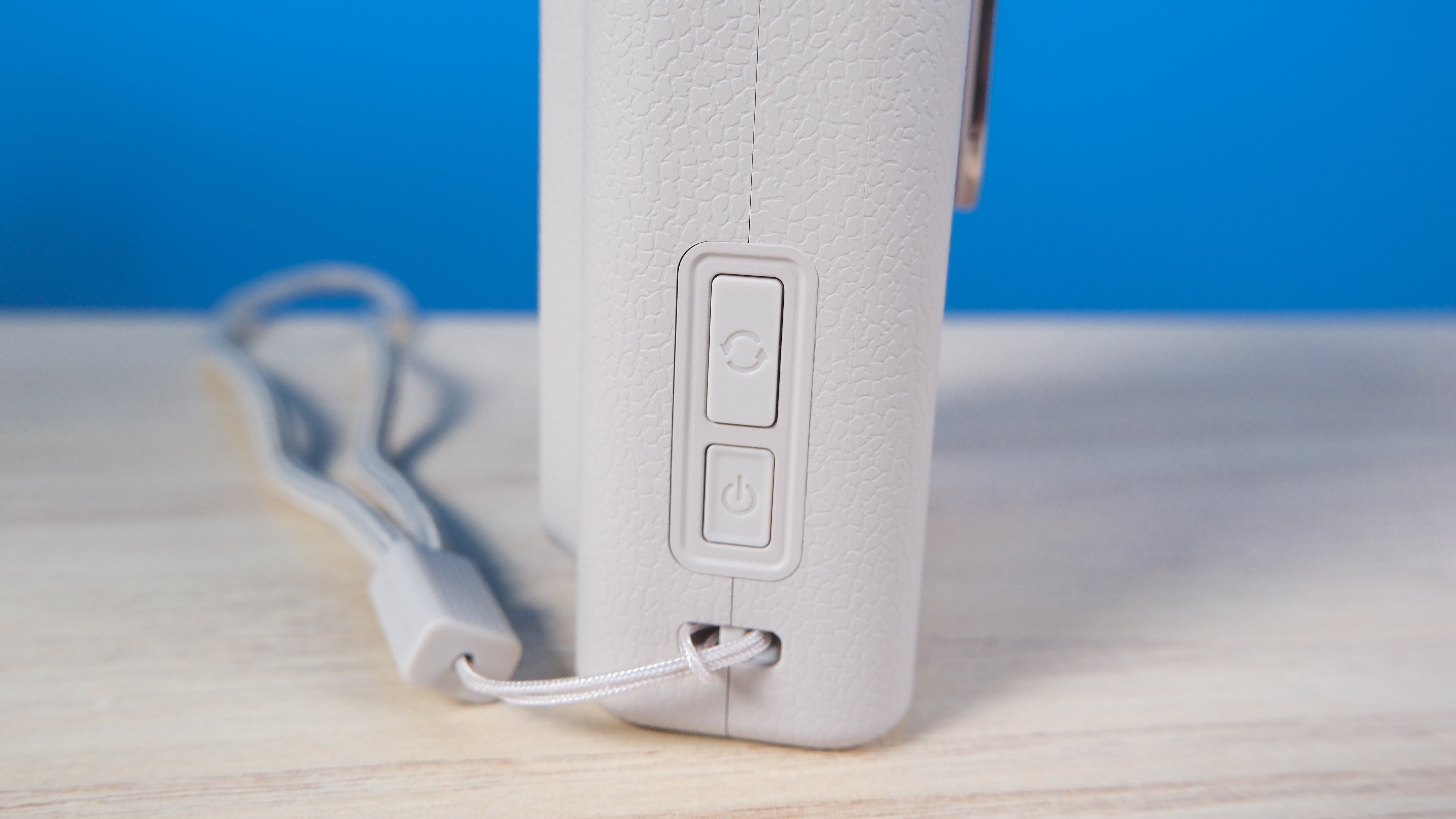 A Sand Beige Fujifilm Instax mini LiPlay Plus hybrid instant camera