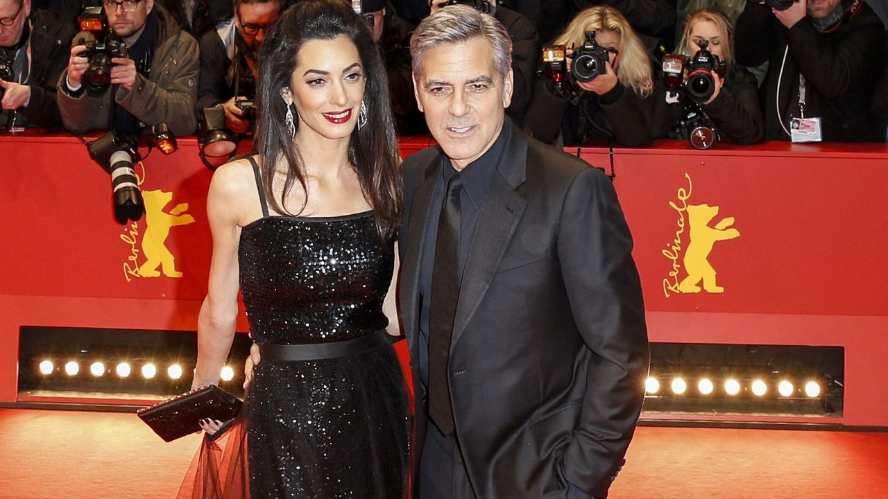 George &amp; Amal Clooney dressed in black at a public event