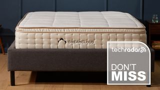 The DreamCloud hybrid mattress on a bed frame, and a TechRadar deals graphic 