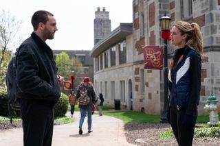 Jackson White as Stephen and Grace Van Patten as Lucy stand in their college quarters in the second season of Tell Me Lies.