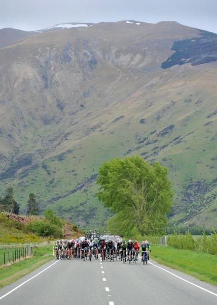 The peloton are dwarfed by the stunning landscape