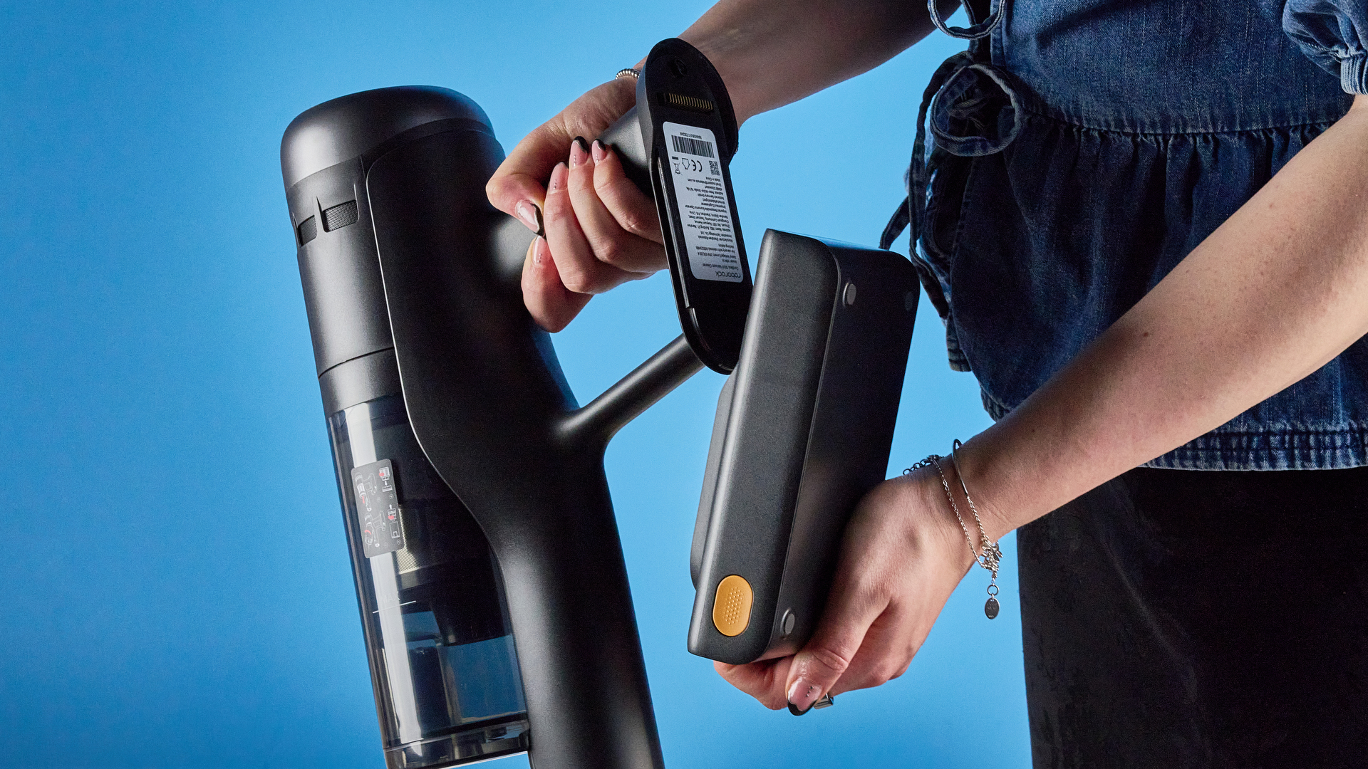 Roborock H60 Hub Ultra photograped in front f a blue background