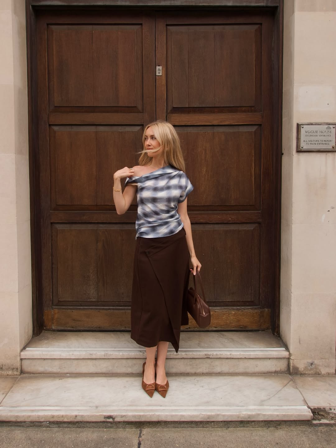 Chloe wearing check top