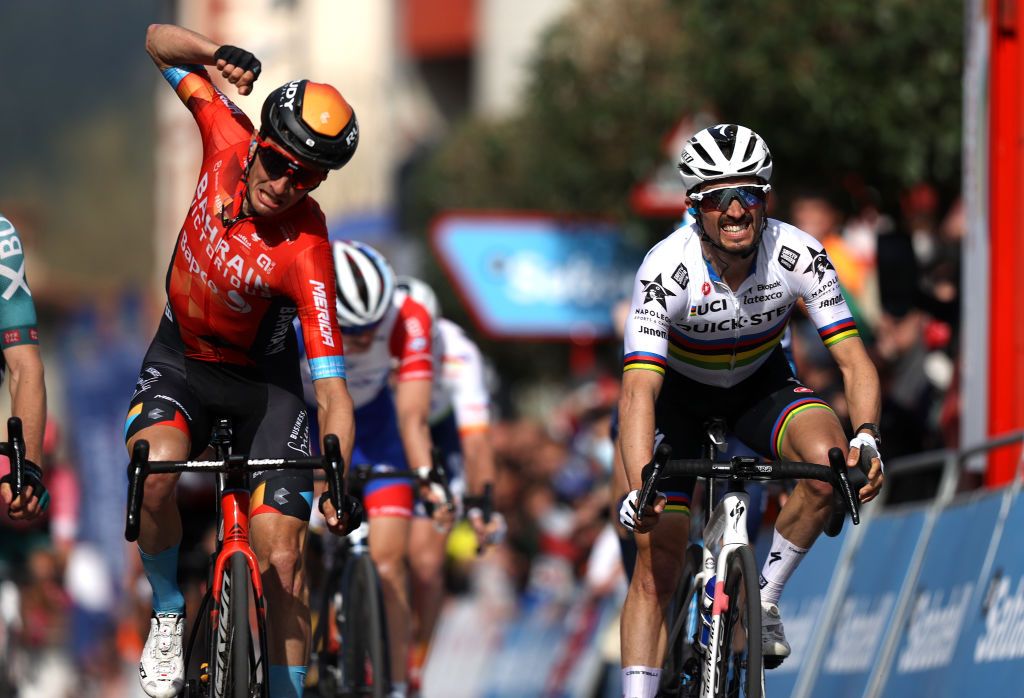 AMURRIO SPAIN APRIL 06 Pello Bilbao Lpez De Armentia of Spain and Team Bahrain Victorious celebrates at finish line as stage winner ahead of Julian Alaphilippe of France and Team QuickStep Alpha Vinyl during the 61st Itzulia Basque Country 2022 Stage 3 a 1817km stage from Llodio to Amurrio itzulia WorldTour on April 06 2022 in Amurrio Spain Photo by Gonzalo Arroyo MorenoGetty Images