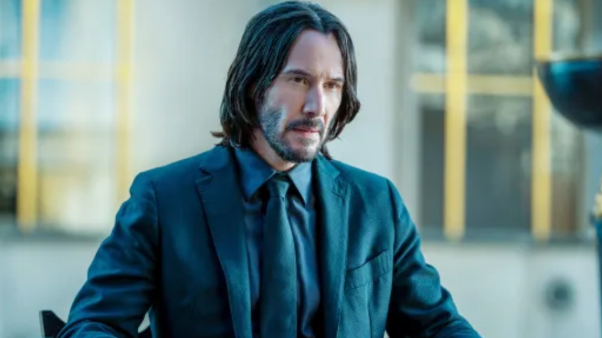 A new R-rated action movie produced by Sam Raimi lands John Wick comparisons, but the director thinks there’s an important difference