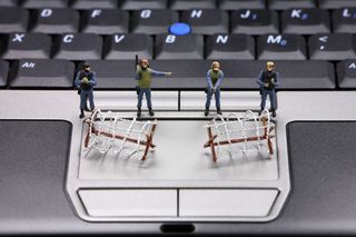 soldiers protecting laptop