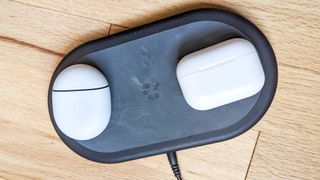 Google Pixel Buds Pro and AirPods Pro displayed in cases next to each other