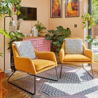 seating area with yellow armchairs